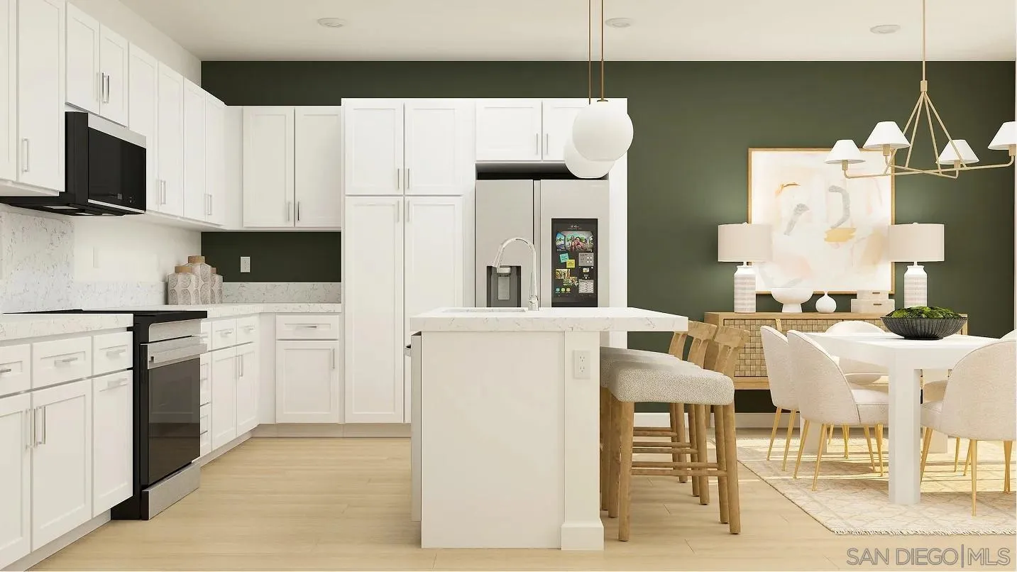 342 Summer Breeze Way Oceanside, CA 92057 - Photo 4 of 12 a kitchen with stainless steel appliances kitchen island granite countertop a refrigerator and a stove top oven