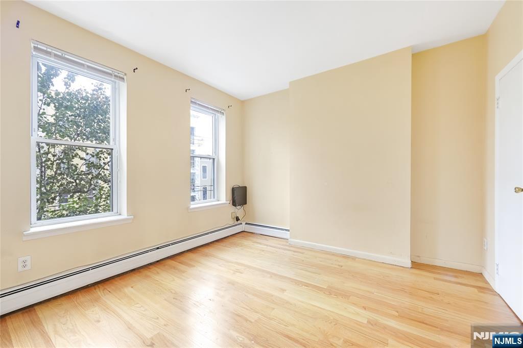 523 Adams Street, Unit 3 Hoboken, NJ 07030 - Photo 15 of 19 a view of an empty room with a window