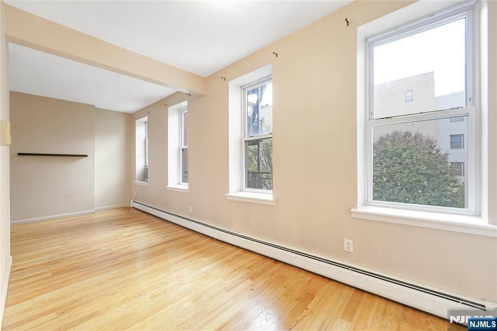 523 Adams Street, Unit 3 Hoboken, NJ 07030 - Photo 7 of 19 a view of an empty room with a window