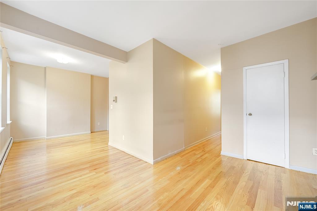 523 Adams Street, Unit 3 Hoboken, NJ 07030 - Photo 8 of 19 a view of an empty room with wooden floor