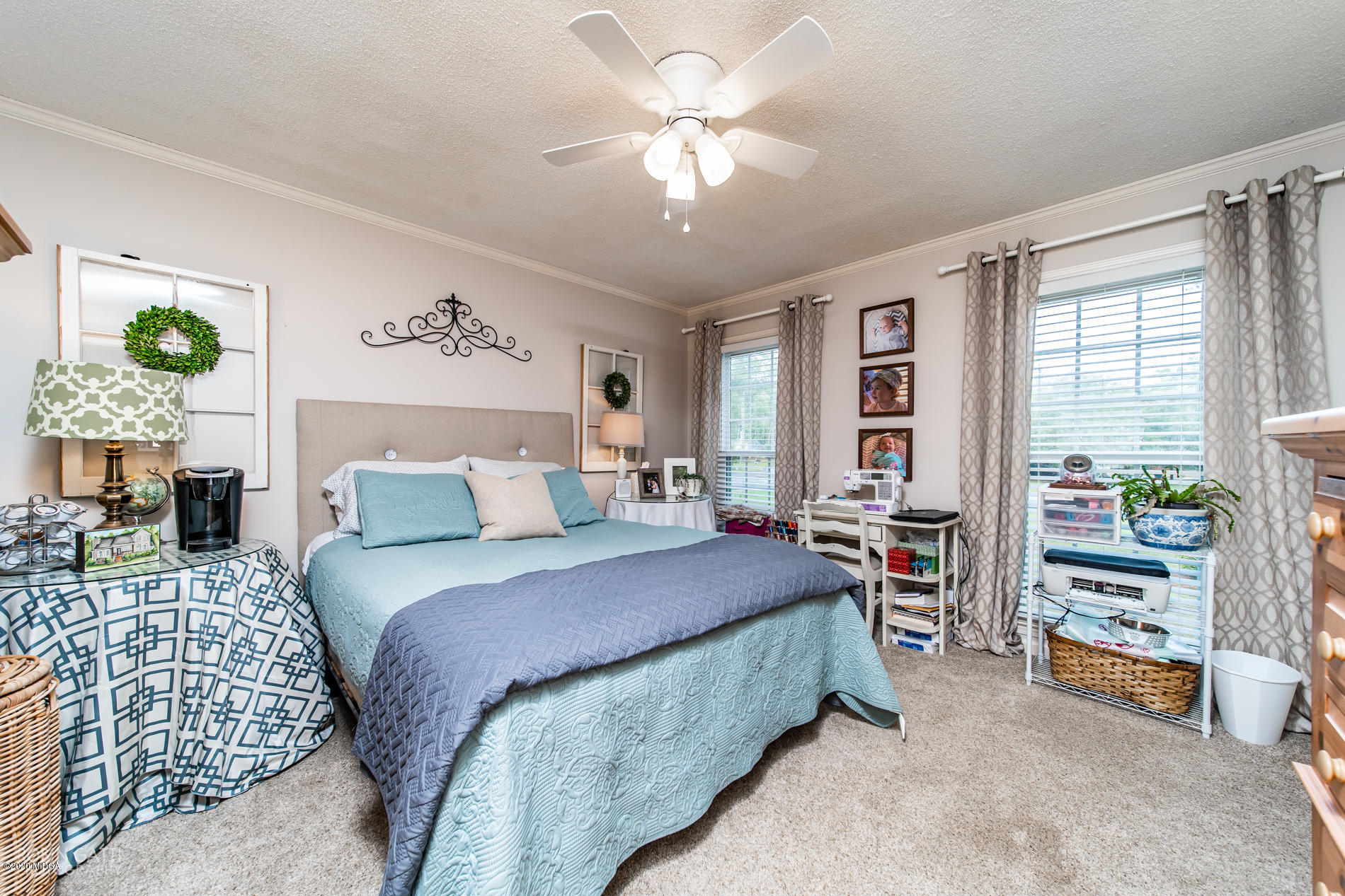 140 Castlegate Road Macon, GA 31210 - Photo 22 of 39 a bedroom with a bed and a chandelier