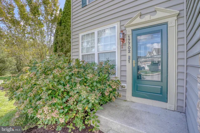 front view of a brick house with a large window