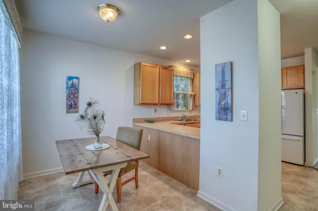 a kitchen with a table and chairs in it