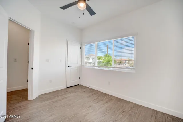a bathroom with a granite countertop sink a toilet and shower