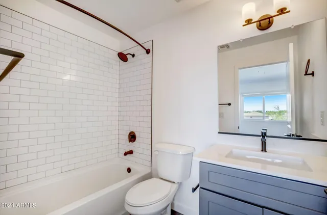 a view of a hallway with washer and dryer