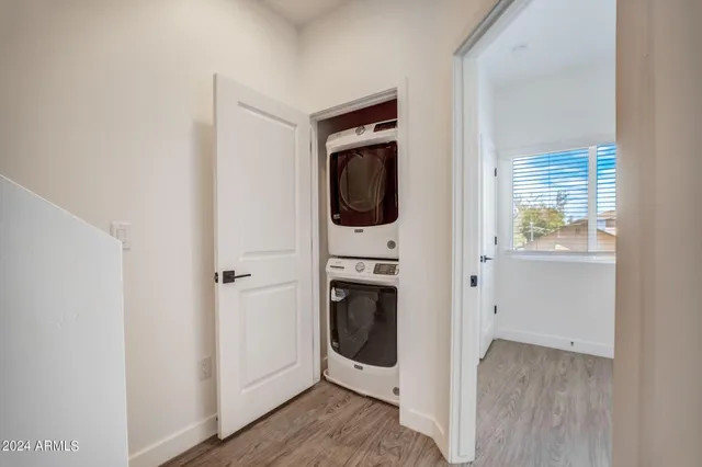 a bathroom with a double vanity sink a mirror and a shower