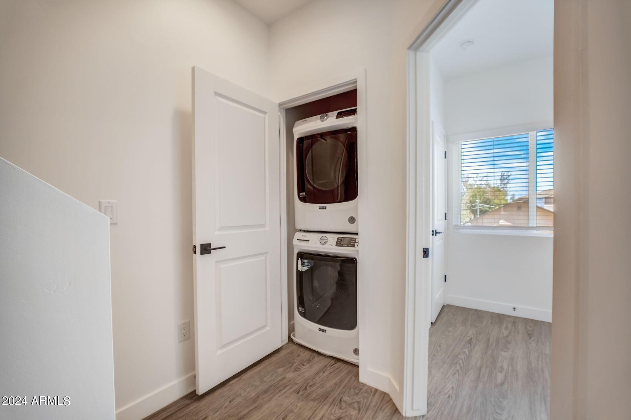 3725 East Earll Drive, Unit 2 Phoenix, AZ 85018 - Photo 13 of 23 a view of a hallway with washer and dryer