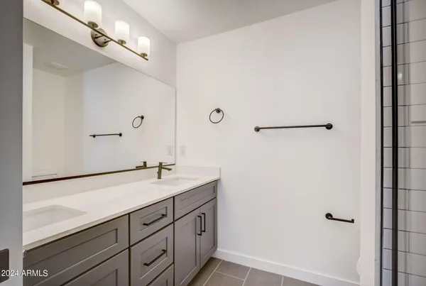 a bathroom with a sink a mirror and bathtub