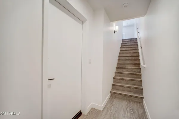 a view of kitchen with stainless steel appliances refrigerator stove microwave and cabinets