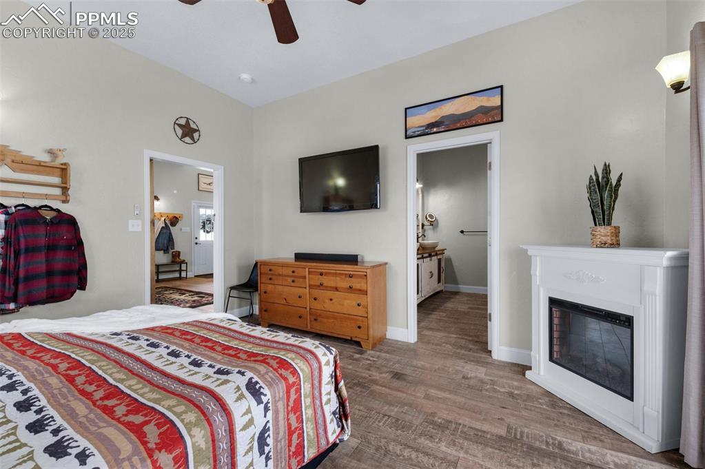 311 Knickerbocker Road Silver Cliff, CO 81252 - Photo 14 of 50 a bedroom with a bed and a television