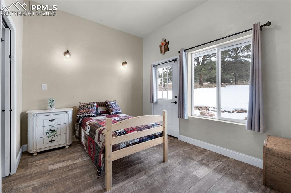 311 Knickerbocker Road Silver Cliff, CO 81252 - Photo 17 of 50 a bedroom with a bed and a window