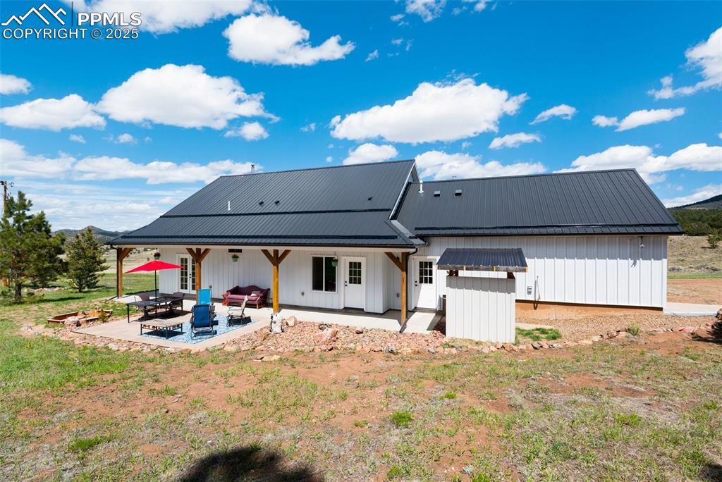311 Knickerbocker Road Silver Cliff, CO 81252 - Photo 30 of 50 a view of outdoor space with seating area and barbeque oven