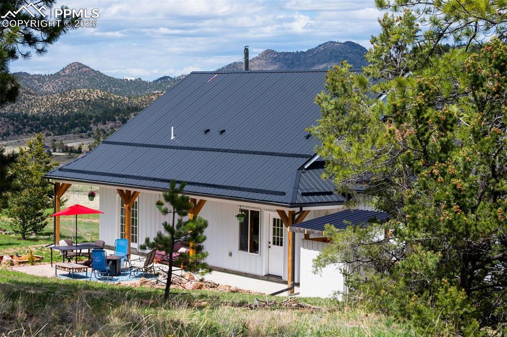 311 Knickerbocker Road Silver Cliff, CO 81252 - Photo 33 of 50 an aerial view of a house with a yard