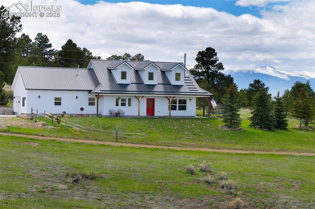 311 Knickerbocker Road Silver Cliff, CO 81252 - Photo 34 of 50 a front view of house with yard and green space