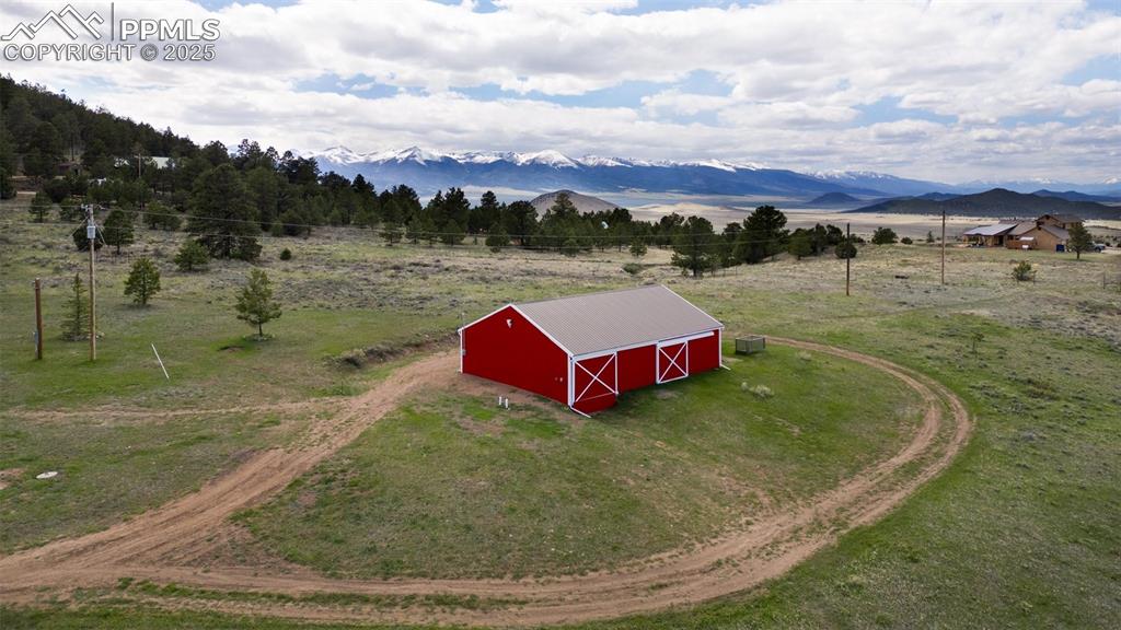311 Knickerbocker Road Silver Cliff, CO 81252 - Photo 38 of 50 a view of a lake with a house in the background