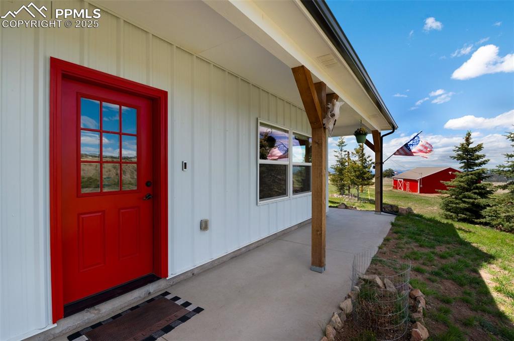 311 Knickerbocker Road Silver Cliff, CO 81252 - Photo 4 of 50 a view of a red door and an outdoor space