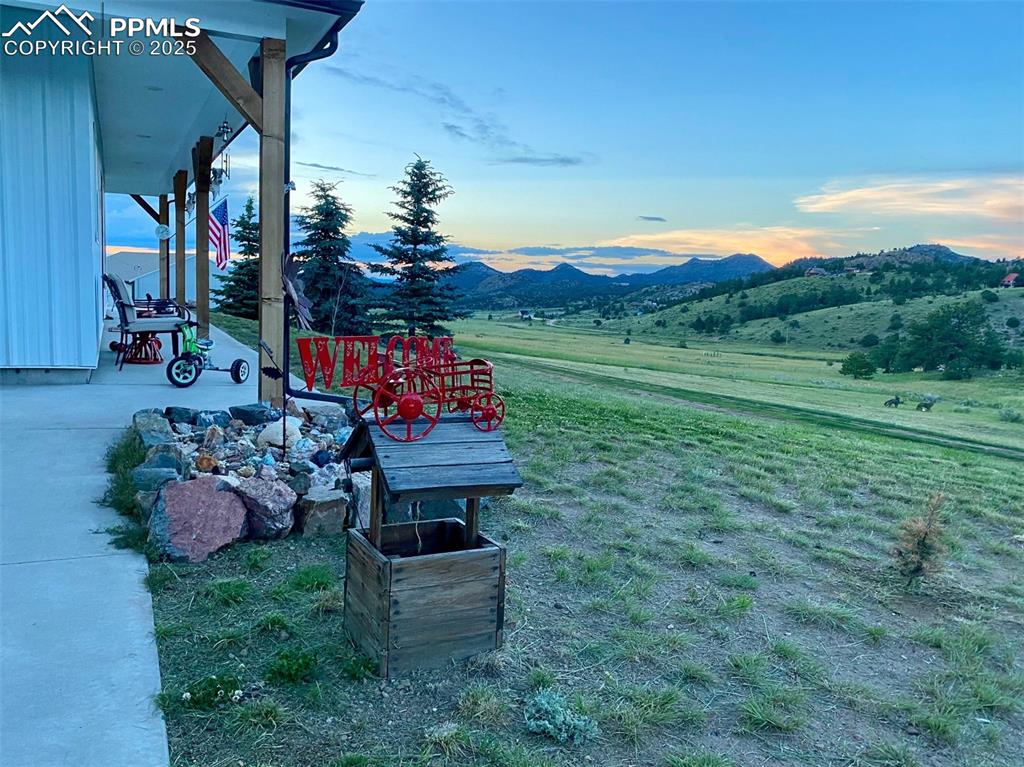 311 Knickerbocker Road Silver Cliff, CO 81252 - Photo 45 of 50 a backyard of a house with table and chairs