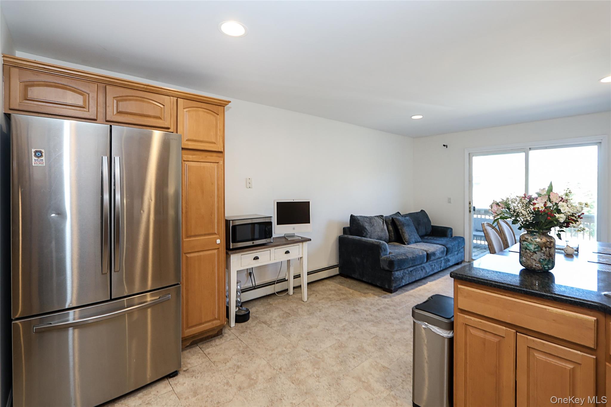 54 Landing Road Glen Cove, NY 11542 - Photo 15 of 24 a living room with furniture a refrigerator and a sink