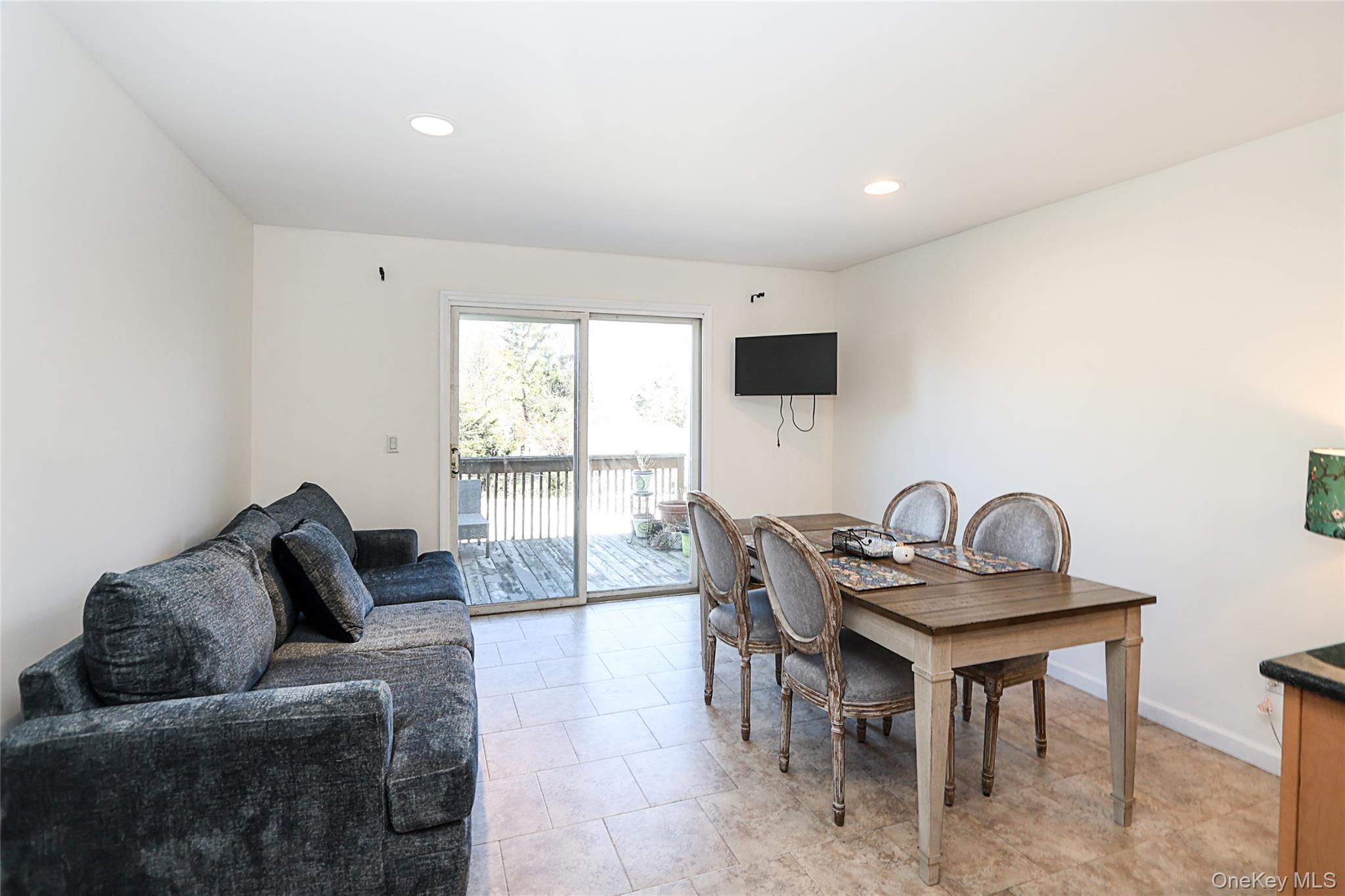 54 Landing Road Glen Cove, NY 11542 - Photo 16 of 24 a living room with furniture and a window