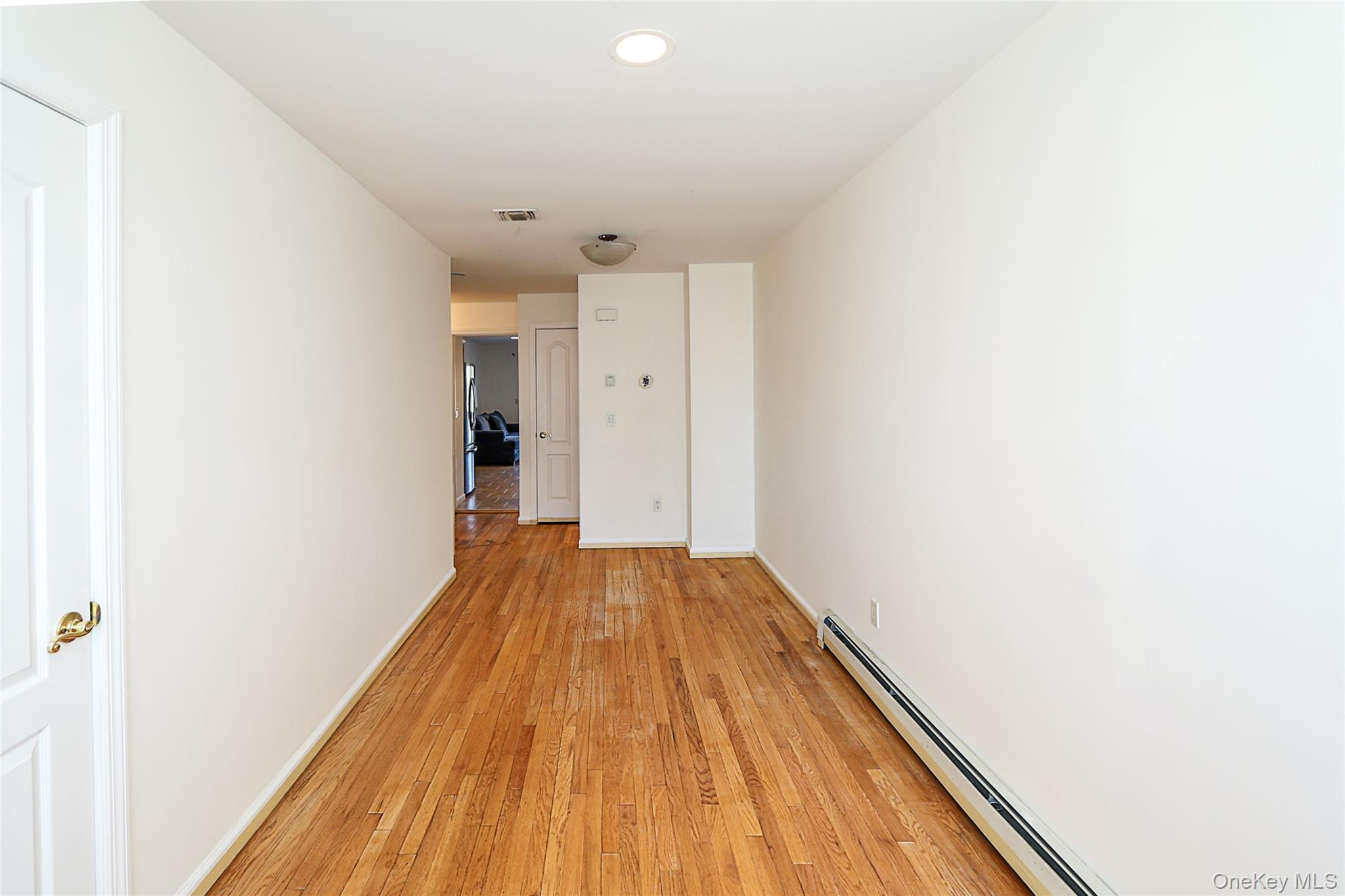 54 Landing Road Glen Cove, NY 11542 - Photo 7 of 24 a view of a room with wooden floor