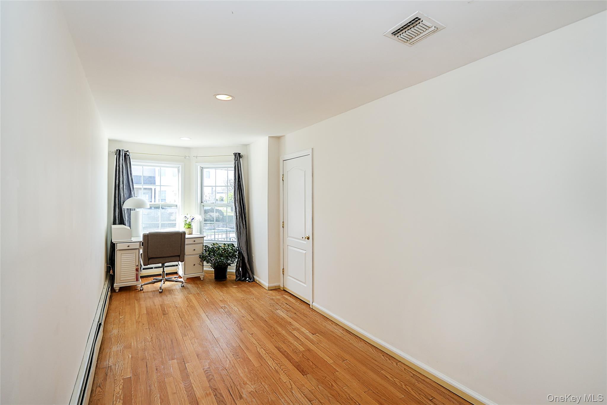 54 Landing Road Glen Cove, NY 11542 - Photo 8 of 24 a view of a room with wooden floor and furniture