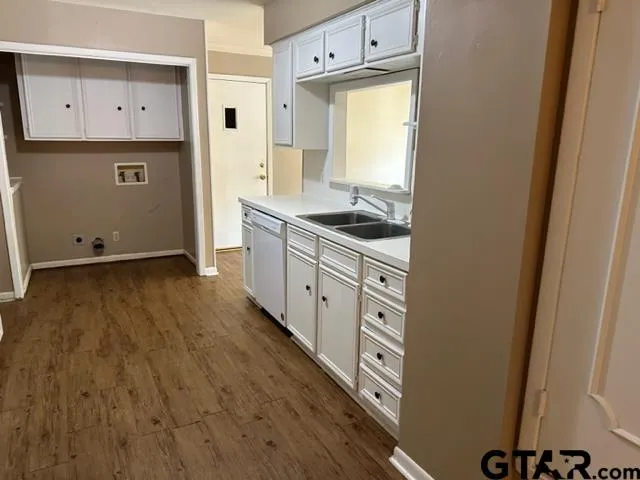 a spacious bathroom with a sink and a mirror