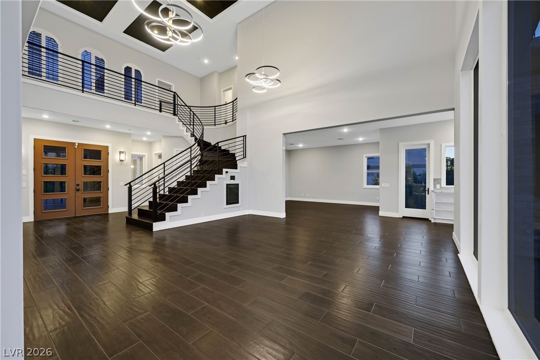 6 Rue Du Ville Henderson, NV 89011 - Photo 45 of 99 This grand foyer welcomes with a striking staircase and elegant flooring.