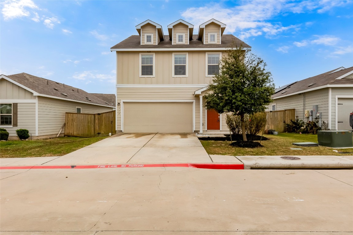 772 Circle Way Jarrell, TX 76537 - Photo 1 of 35 Traditional-style home with driveway, a garage, and board and batten siding