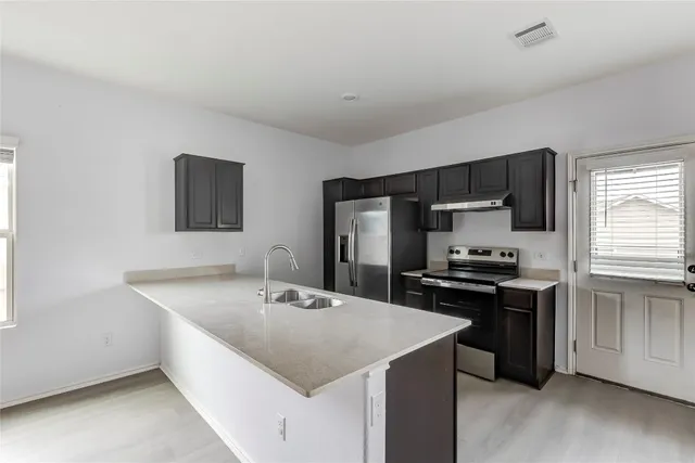 a view of kitchen with wooden floor