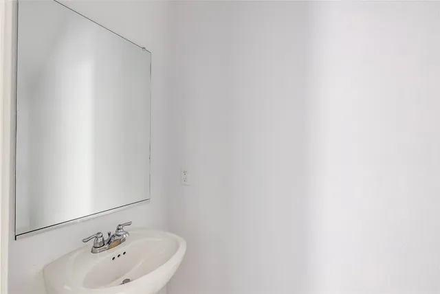a view of a kitchen with a sink and a window