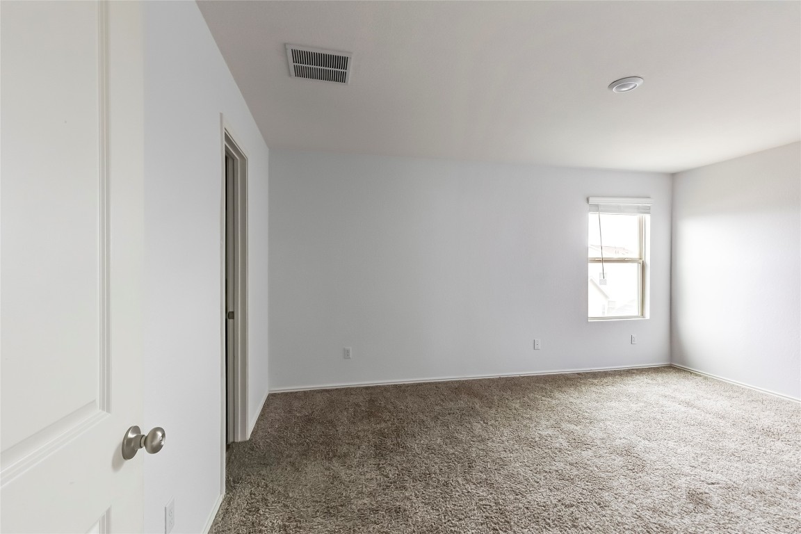772 Circle Way Jarrell, TX 76537 - Photo 18 of 35 Unfurnished room with dark carpet