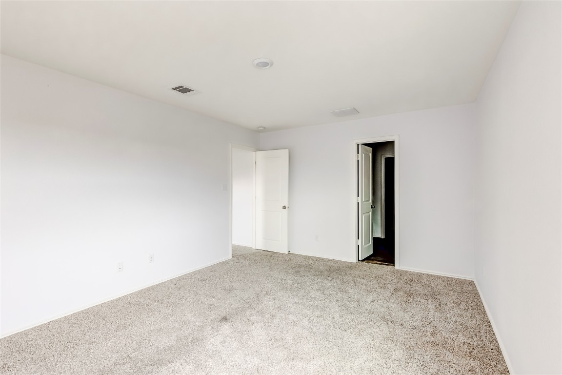772 Circle Way Jarrell, TX 76537 - Photo 19 of 35 Unfurnished bedroom featuring carpet flooring and baseboards