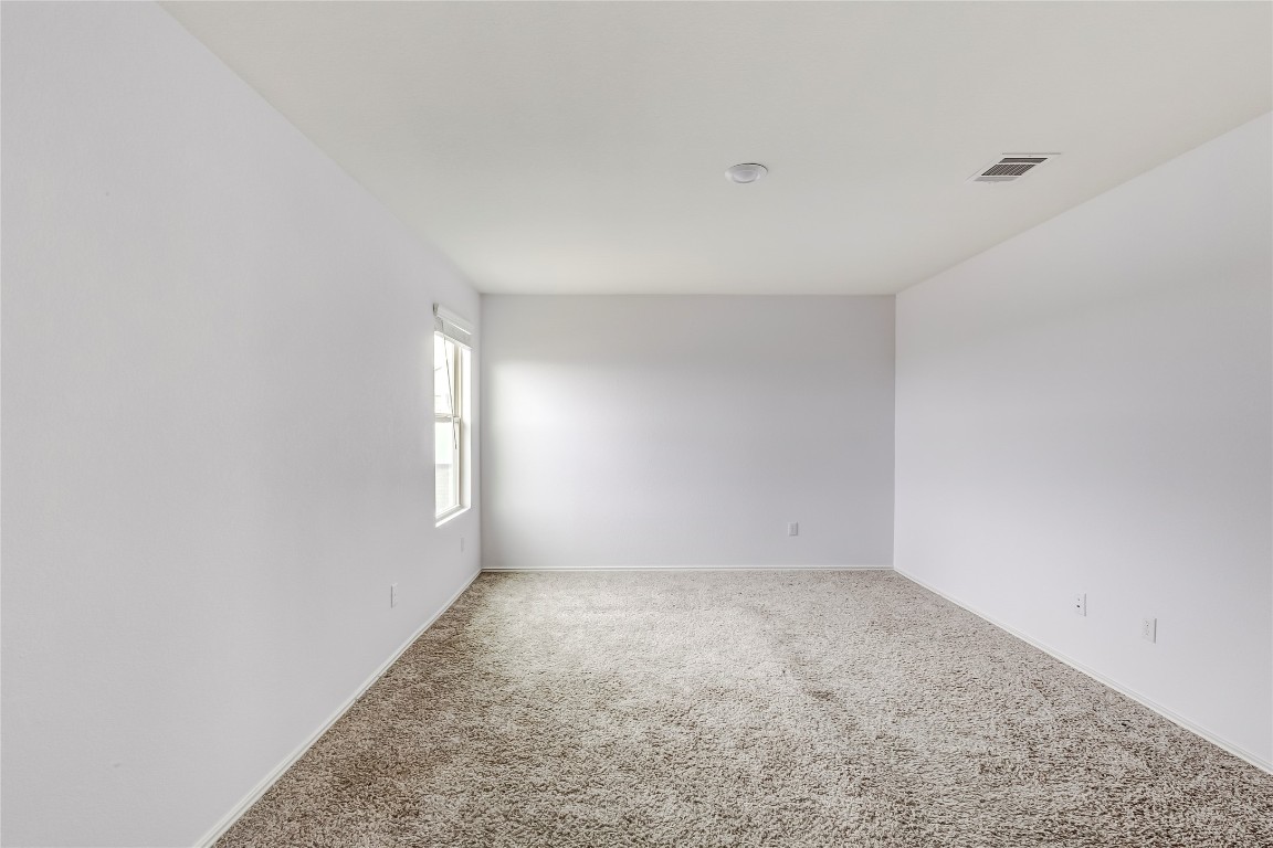 772 Circle Way Jarrell, TX 76537 - Photo 21 of 35 Spare room with carpet floors and baseboards