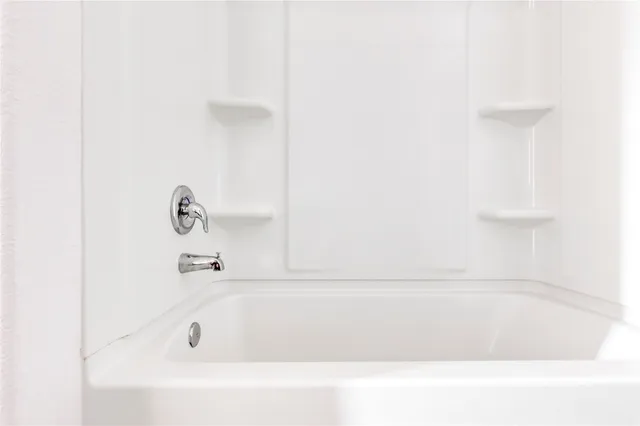 an empty room with a empty space and window