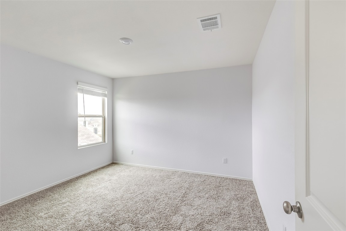 772 Circle Way Jarrell, TX 76537 - Photo 24 of 35 Spare room featuring carpet and baseboards