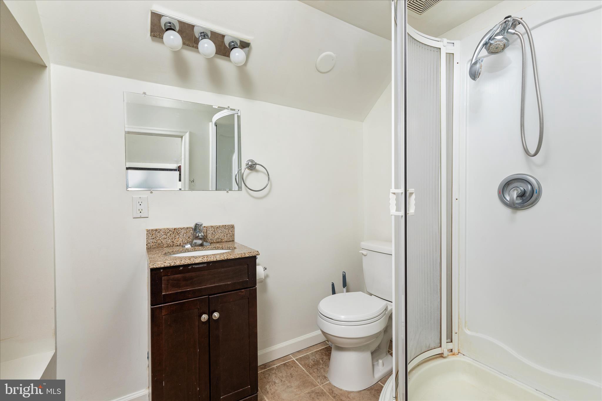 1200 Salem Church Road Stephens City, VA 22655 - Photo 28 of 69 a bathroom with a toilet sink vanity shower and mirror