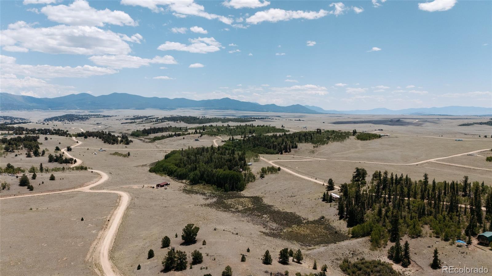 458 Remington Road Como, CO 80432 - Photo 7 of 17 a view of a lake with a mountain in the background