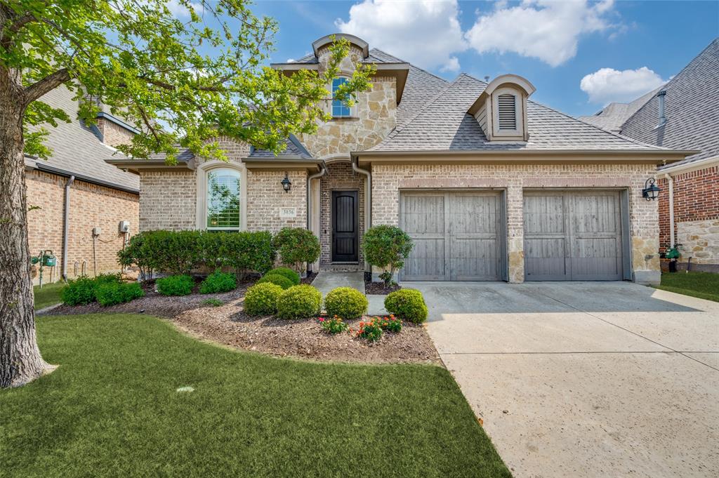 Welcome to 3036 Avondale Drive, a beautifully crafted home built by American Legend Homes, where timeless brick and stone architecture is complemented by meticulously maintained landscaping and inviting curb appeal. Lush greenery, thoughtfully designed flower beds, and mature trees create a warm and welcoming first impression, all nestled within the highly sought-after Tribute Golf & Resort Community.