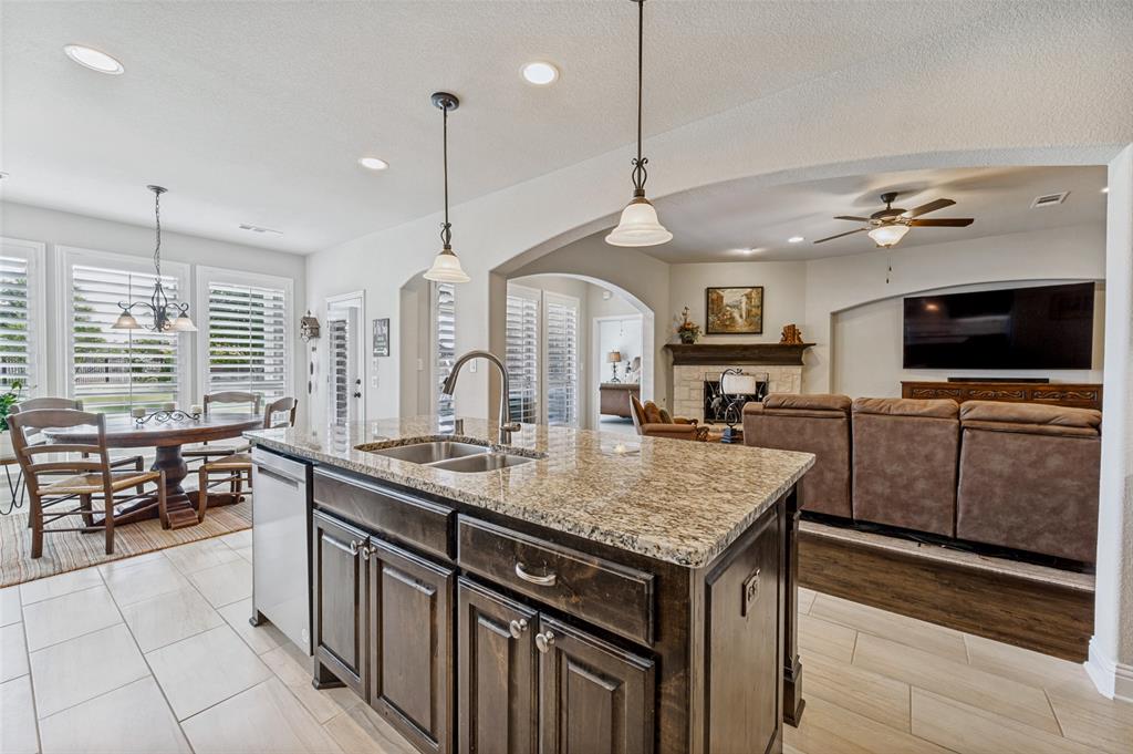 3036 Avondale The Colony, TX 75056 - Photo 17 of 40 From the kitchen, everything flows together effortlessly—you can cook, gather, and still feel connected to the living and dining spaces.