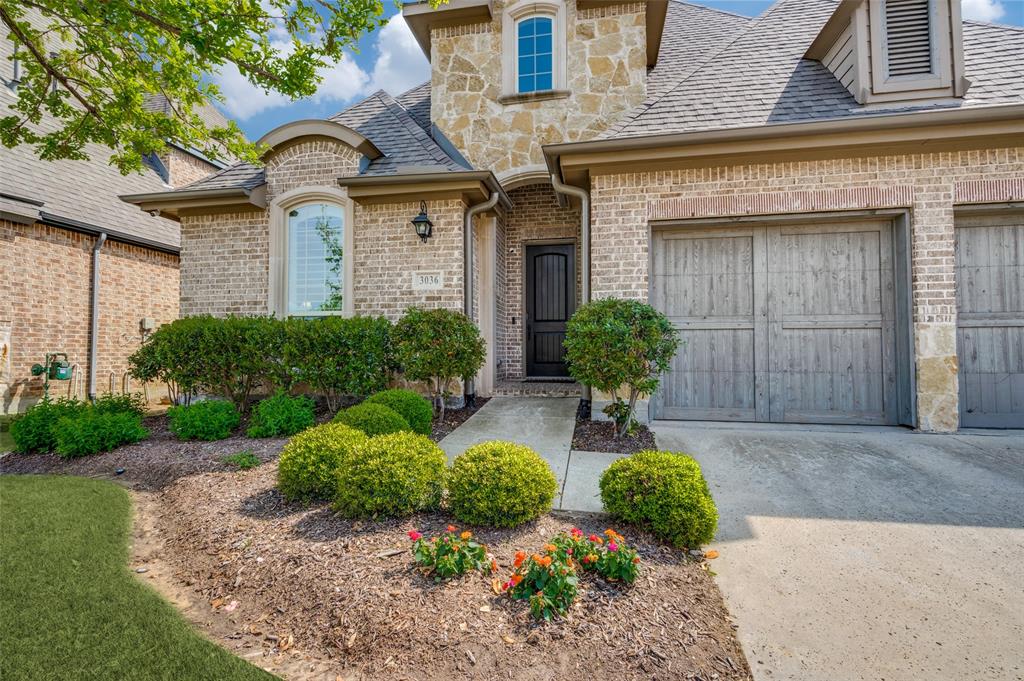 3036 Avondale The Colony, TX 75056 - Photo 2 of 40 As you walk up, you’re welcomed by beautifully maintained landscaping with lush greenery, manicured shrubs, and pops of seasonal color that make the home feel warm and inviting from the very first step.