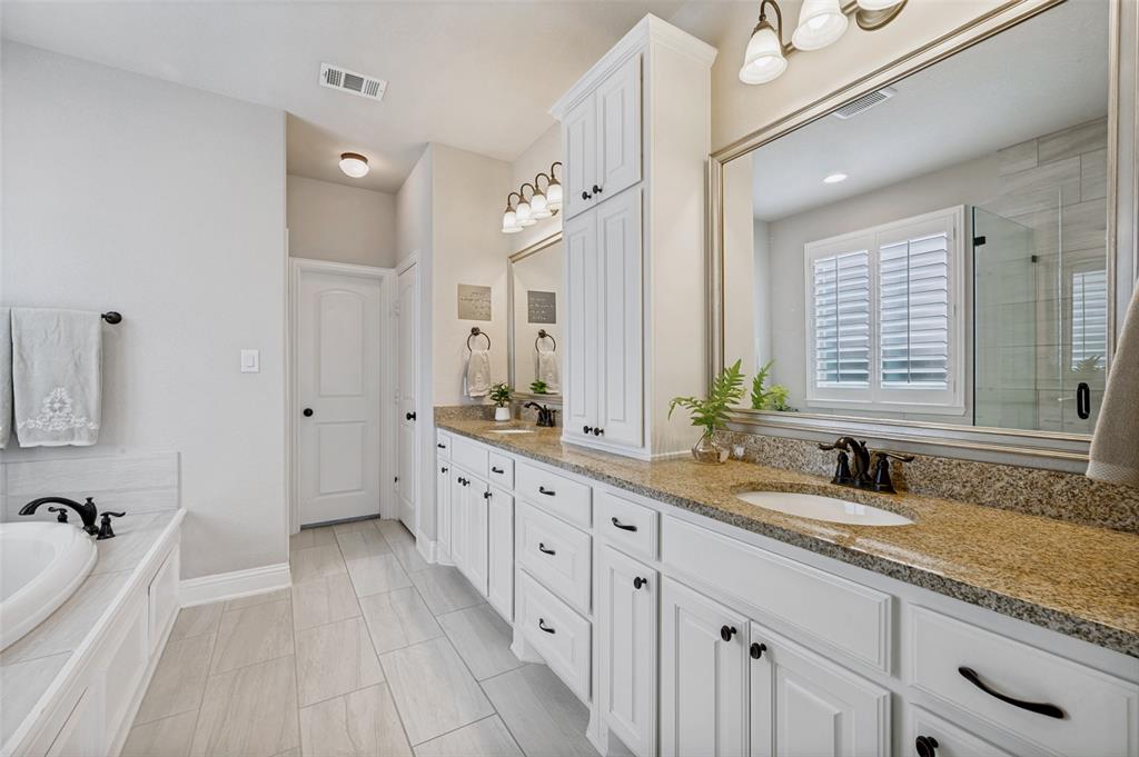 3036 Avondale The Colony, TX 75056 - Photo 22 of 40 The ensuite continues with a spacious dual vanity, plenty of storage, and a clean, bright feel that makes getting ready easy.
