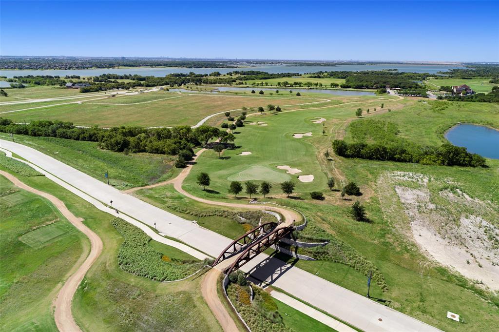 3036 Avondale The Colony, TX 75056 - Photo 38 of 40 From resort-style pools and a splash park to playgrounds, dog parks, and vibrant community events, The Tribute offers something for everyone. Whether you’re staying active, enjoying the outdoors, or soaking in breathtaking lakeside views and unforgettable Texas sunsets, this community delivers a lifestyle that goes far beyond just a place to call home—it’s a true lakeside experience.