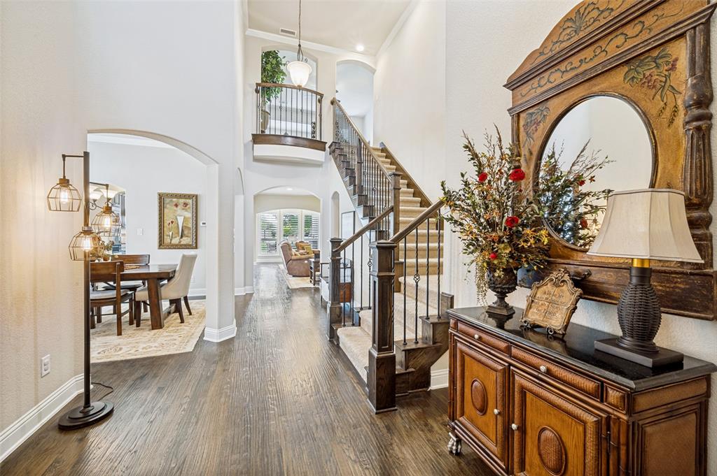 3036 Avondale The Colony, TX 75056 - Photo 4 of 40 As you move through the entry, you’ll notice the soaring ceilings, gorgeous hardwood floors, and a stunning staircase that really anchors the space.
