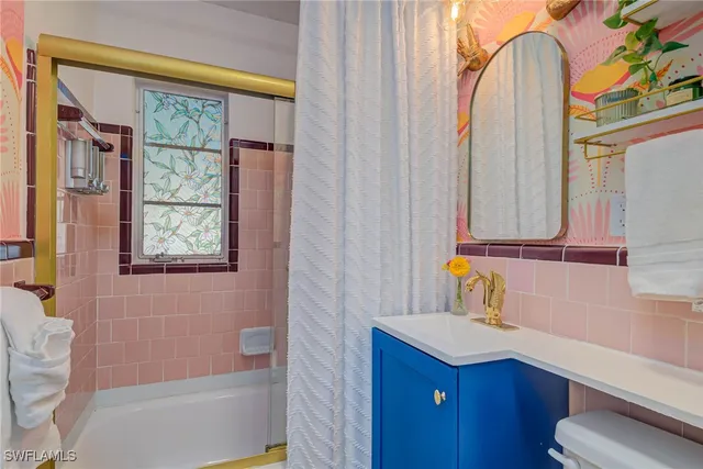 a bathroom with a sink a vanity and a mirror