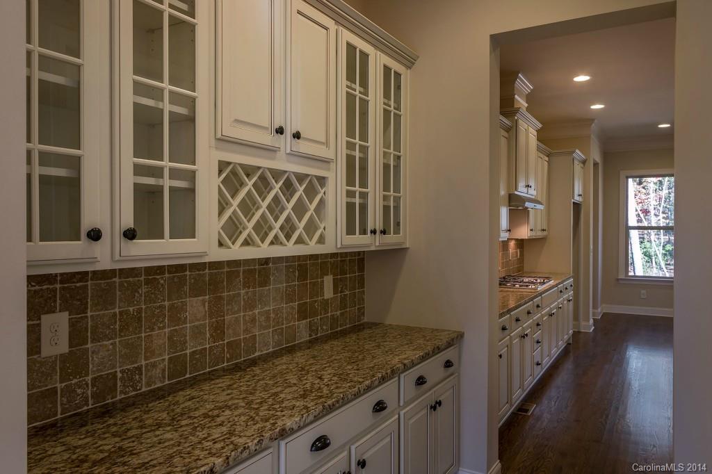 1600 Buckland Court Indian Land, SC 29707 - Photo 13 of 24 a bathroom with a granite countertop sink and a shower