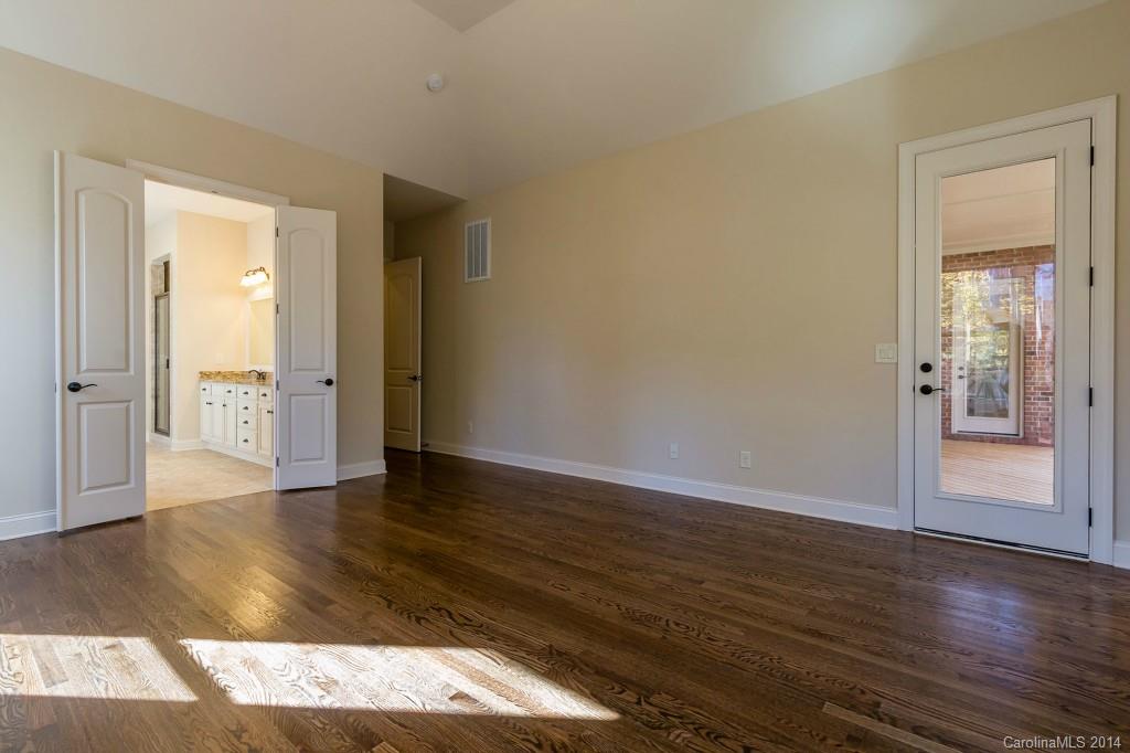 1600 Buckland Court Indian Land, SC 29707 - Photo 14 of 24 a view of an empty room with wooden floor & a window