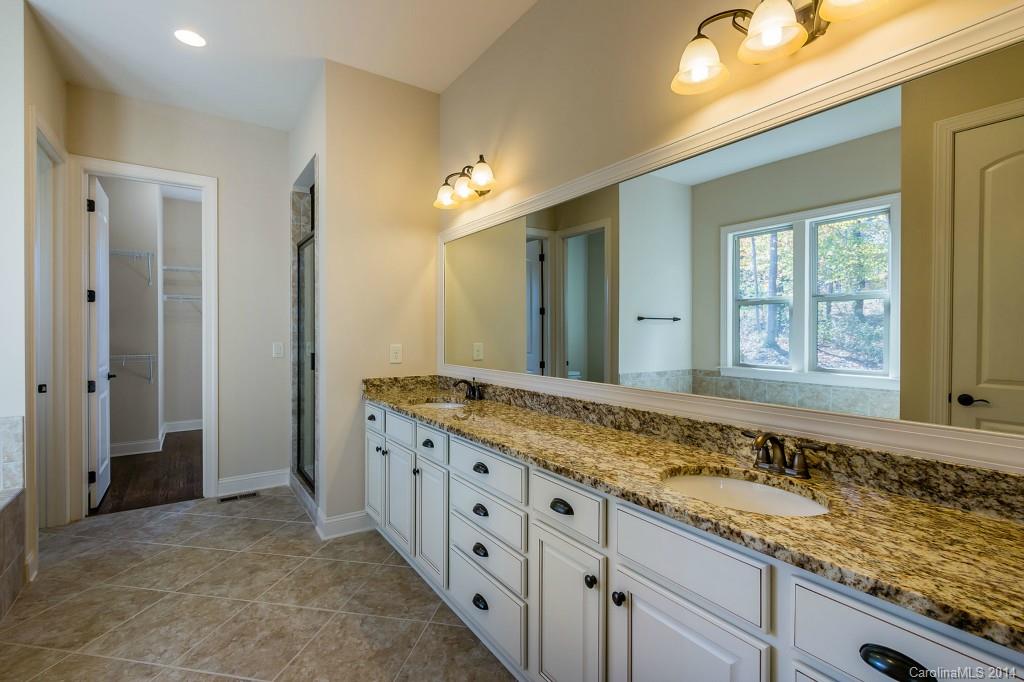 1600 Buckland Court Indian Land, SC 29707 - Photo 15 of 24 a bathroom with a granite countertop sink and a mirror