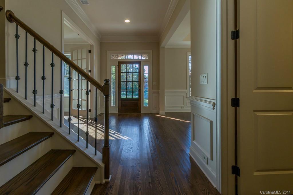 1600 Buckland Court Indian Land, SC 29707 - Photo 4 of 24 a view of a hallway with wooden floor and staircase