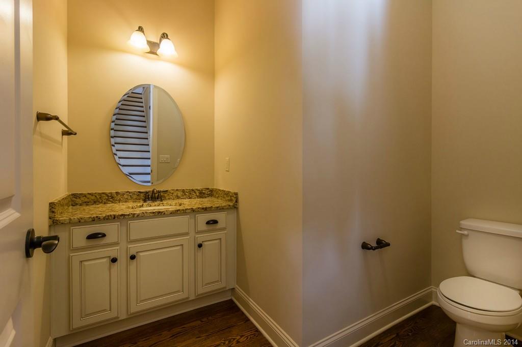 1600 Buckland Court Indian Land, SC 29707 - Photo 7 of 24 a bathroom with a granite countertop toilet and a sink
