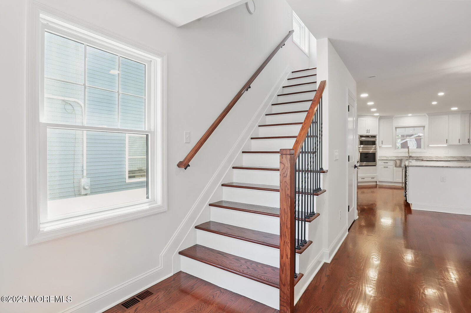 18 Neptune Place North Middletown, NJ 07748 - Photo 13 of 49 a view of a kitchen with wooden floor and electronic appliances